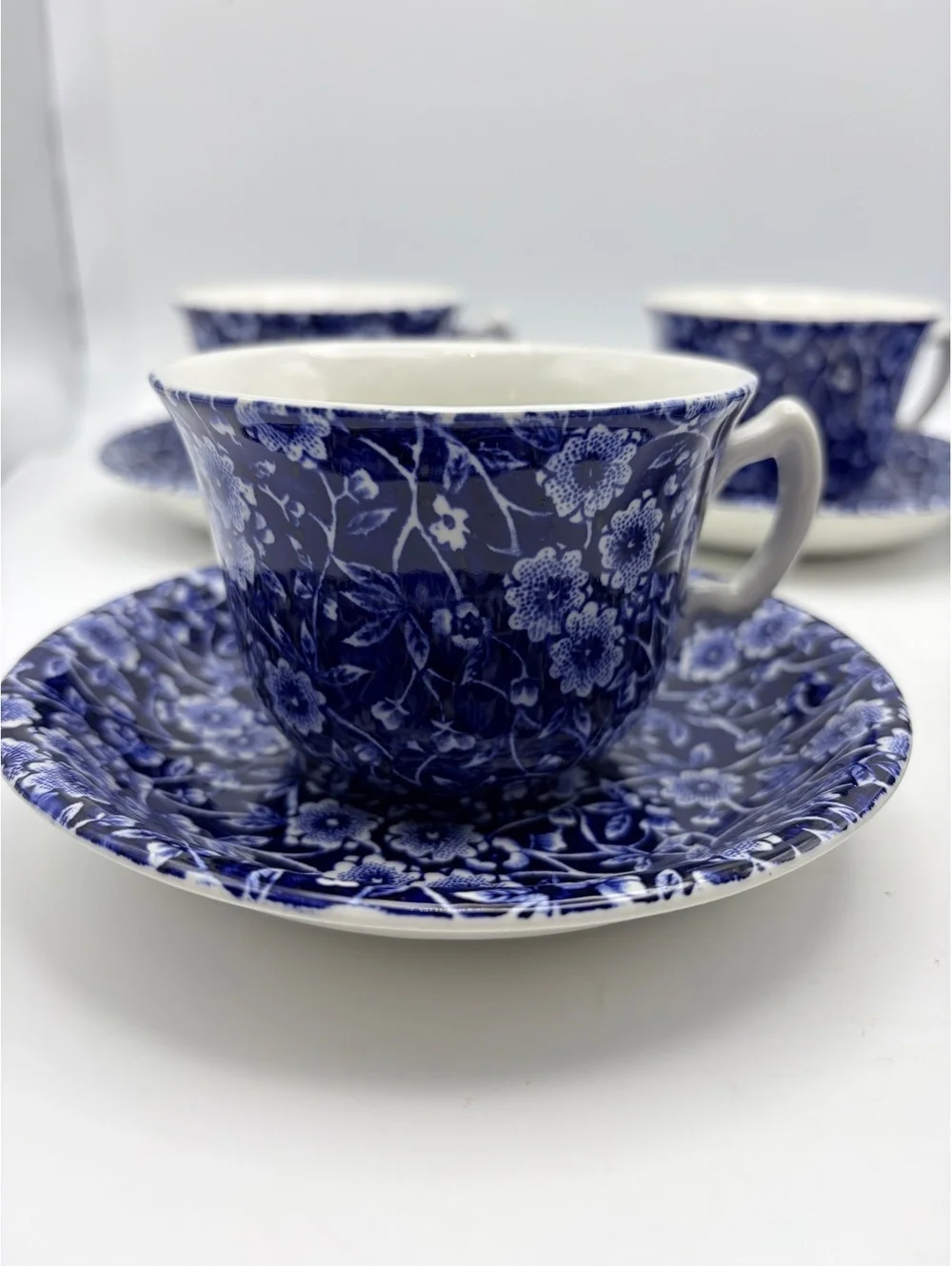 5 vintage sets of cups and saucers. Blue on white 1968 England.